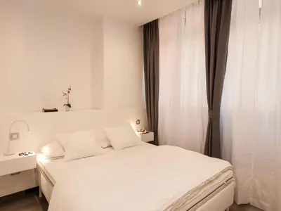 Cama o camas de una habitación en Apartments Las Canteras Beach LM3 by VillaGranCanaria
