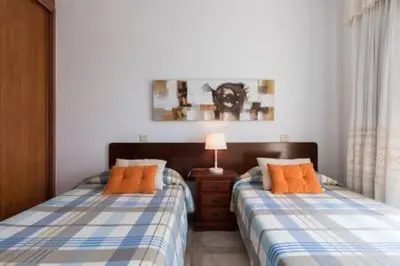 Cama o camas de una habitación en Apartamentos Castillo Mar Gran Canaria