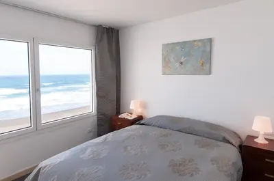 Cama o camas de una habitación en Terrace on the Beach