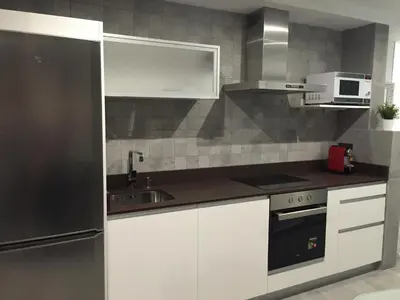 Una cocina o zona de cocina en Piso con piscina y garaje en la Playa de Las Canteras