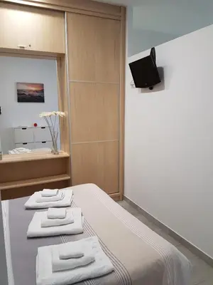 Una televisión o centro de entretenimiento en Vivienda Vacacional AP Las Canteras