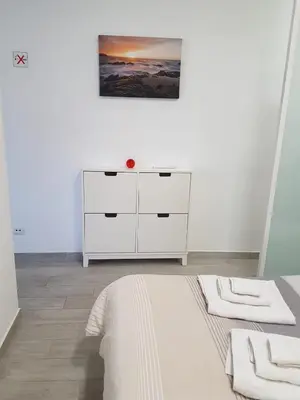 Cama o camas de una habitación en Vivienda Vacacional AP Las Canteras