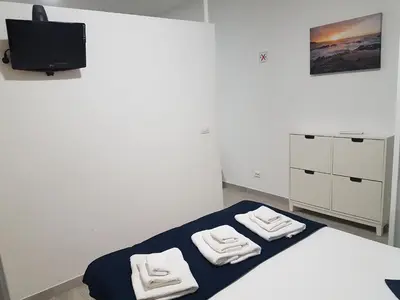 Cama o camas de una habitación en Vivienda Vacacional AP Las Canteras