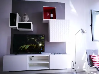 Una televisión o centro de entretenimiento en ENJOY CANTERAS Apartamento