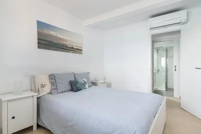 Cama o camas de una habitación en Casa Daura Playa de Arinaga Beach Front