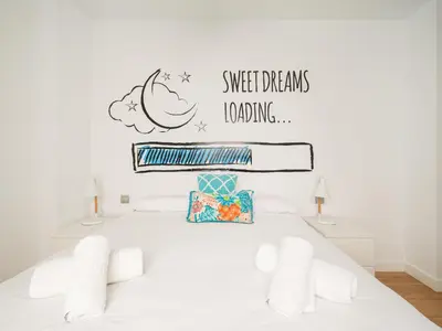 Cama o camas de una habitación en Las Canteras Beach Apartment Sagasta