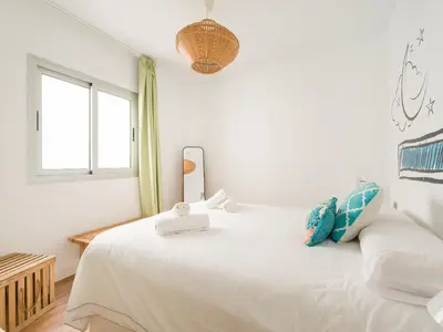 Cama o camas de una habitación en Las Canteras Beach Apartment Sagasta