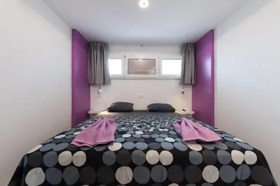 Cama o camas de una habitación en Apartamentos Karma
