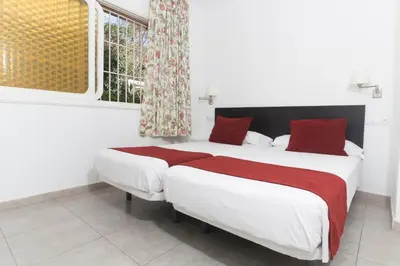 Cama o camas de una habitación en Alsol Mariachis