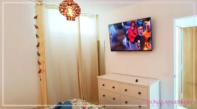 Una televisión o centro de entretenimiento en Dunas Apartment Gran Canaria