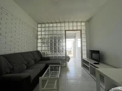 Una televisión o centro de entretenimiento en Seafront Canteras Terrace Lounge