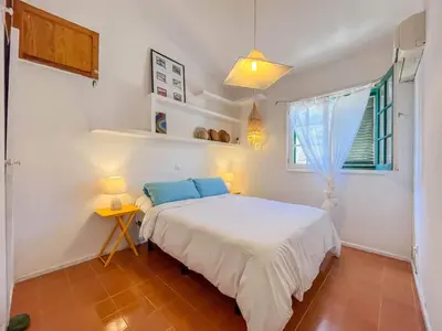 Cama o camas de una habitación en GuestReady Casa Carmen Agaete con terraza y vistas al mar