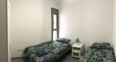 Cama o camas de una habitación en New cozy apartment next to the beach!