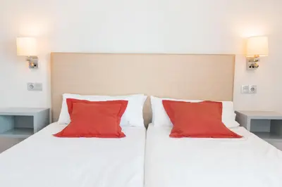 Cama o camas de una habitación en Apartamentos El Palmar