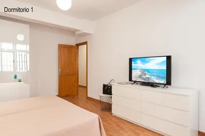 Una televisión o centro de entretenimiento en Kasa Holiday Apartment