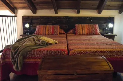 Cama o camas de una habitación en Vivelorural casa Tunte 1, piscina y terraza