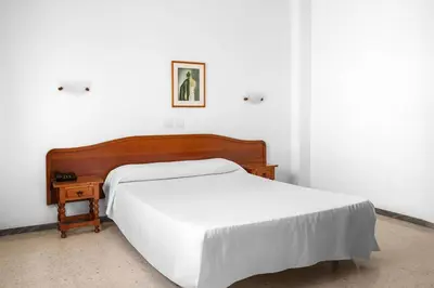 Cama o camas de una habitación en Hotel Valencia