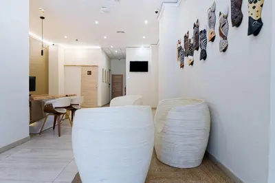 Una televisión o centro de entretenimiento en Ura Hotels Boutique Gurea