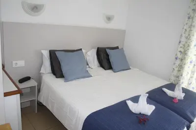 Cama o camas de una habitación en Bungalows Parque Nogal