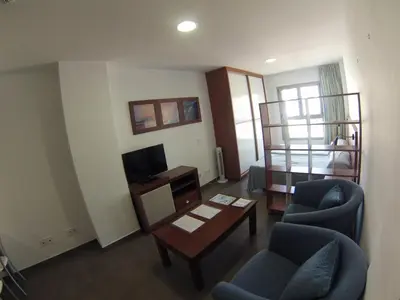 Una televisión o centro de entretenimiento en Loft Canteras