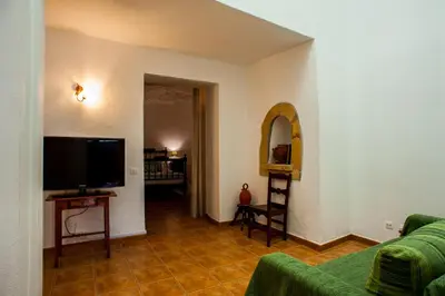 Una televisión o centro de entretenimiento en Casa Cueva El Molino By Artenatur