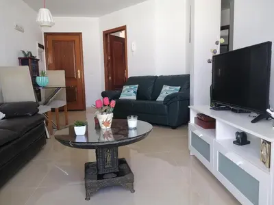 Una televisión o centro de entretenimiento en La Palmita House Flat