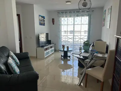 Una televisión o centro de entretenimiento en La Palmita House Flat