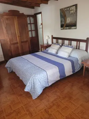 Cama o camas de una habitación en Alojamientos Nicasio