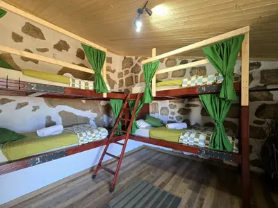 Cama o camas de una habitación en Mountain Hostel&House Finca La Isa by Rose