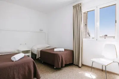 Cama o camas de una habitación en Apartamentos Tarahal