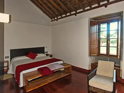 Cama o camas de una habitación en Hotel Rural El Mondalón