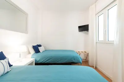 Cama o camas de una habitación en Living Las Canteras Homes - BEACH HOME