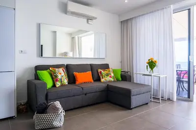 Zona de estar de La Grand Suite Las Canteras