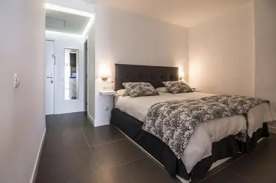 Cama o camas de una habitación en La Grand Suite Las Canteras