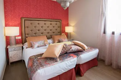 Cama o camas de una habitación en Alhambra Boutique Apartments by PMC Resorts