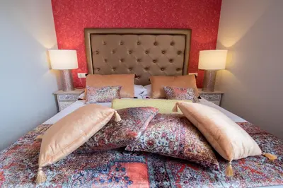 Cama o camas de una habitación en Alhambra Boutique Apartments by PMC Resorts