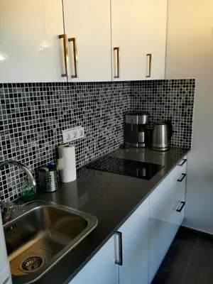 Una cocina o zona de cocina en Modern Apartment