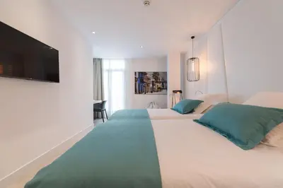 Cama o camas de una habitación en HC Luxe