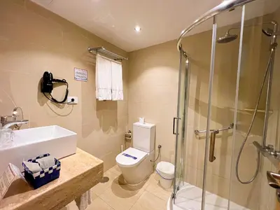 Un baño de Hotel La Aldea Suites