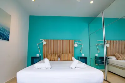 Cama o camas de una habitación en Costa Lairaga Suite. Beachfront! Air conditioned