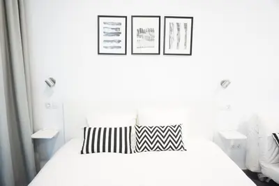 Cama o camas de una habitación en Black & White Las Canteras