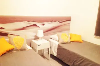Cama o camas de una habitación en Apartamento en Playa de las Burras