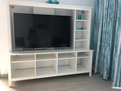 Una televisión o centro de entretenimiento en Venus Star Resort - FKK Nudist Swingers - Only Couples