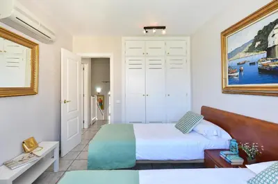 Cama o camas de una habitación en Bungalow Pasito Blanco Marina Port 4 by VillaGranCanaria