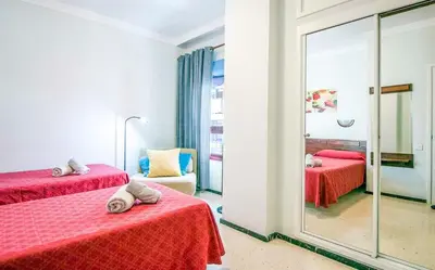 Cama o camas de una habitación en GuestReady - Dimar A pasos de la Playa de Las Canteras