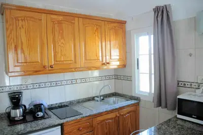 Una cocina o zona de cocina en Bungalows Los Arcos