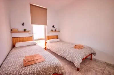Cama o camas de una habitación en Bonito Apartamento 105 by CASAS COCODRILO