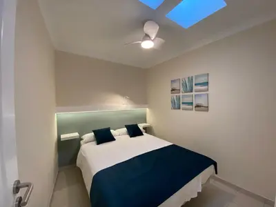 Cama o camas de una habitación en Bungalows Granada Beach
