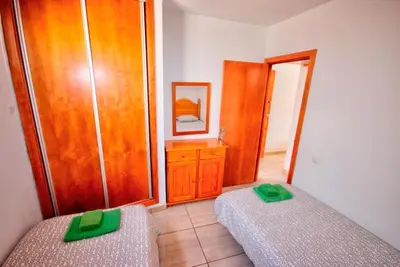 Cama o camas de una habitación en Apartamento al lado de la playa by CASAS COCODRILO