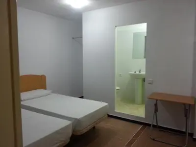 Cama o camas de una habitación en Hostal Casa de Huéspedes San Fernando - Adults Only